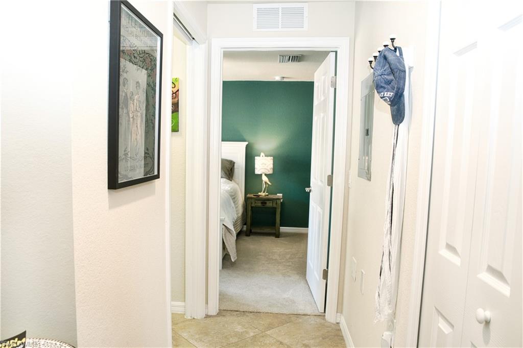 Hallway with tile flooring and neutral wall tones