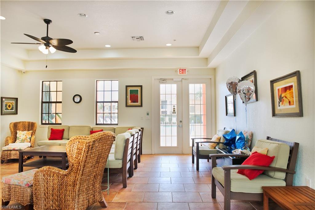 Tile flooring, recessed lighting, exposed ceiling beams, ceiling fan, and French doors