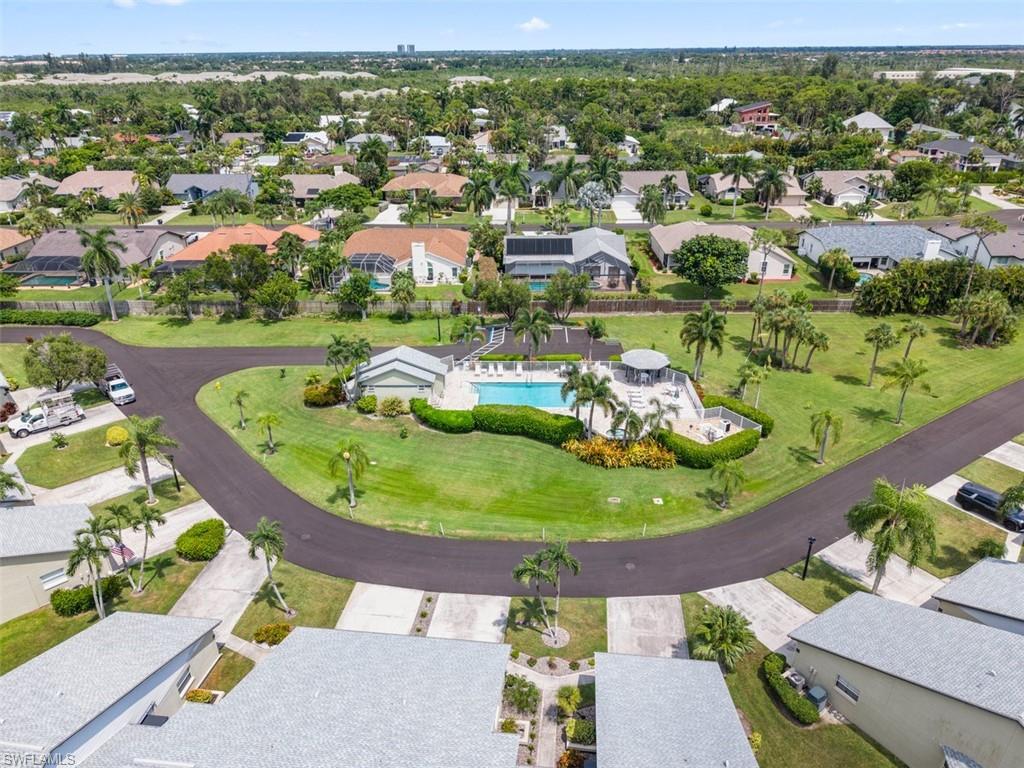 Community swimming pool with surrounding sundeck and gazebo