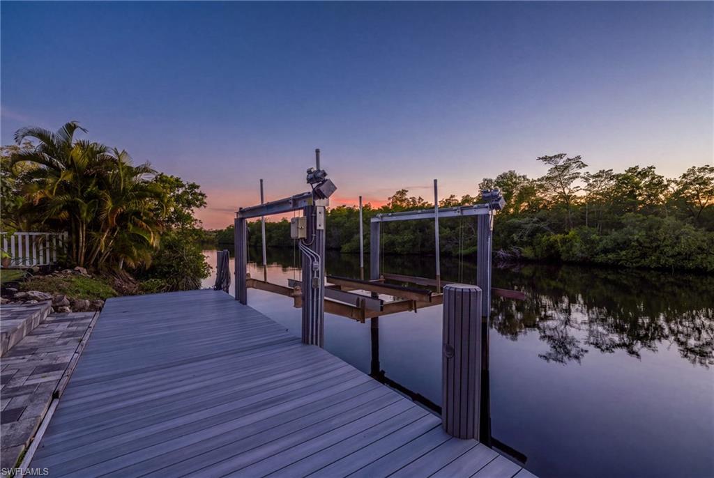 Composite decking pier with boat lift and tranquil water access