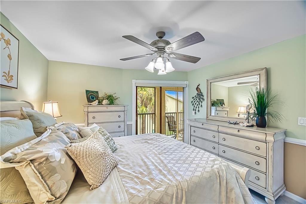 Ceiling fan with integrated lighting, soft green wall color, crown molding, and direct access to an outdoor area