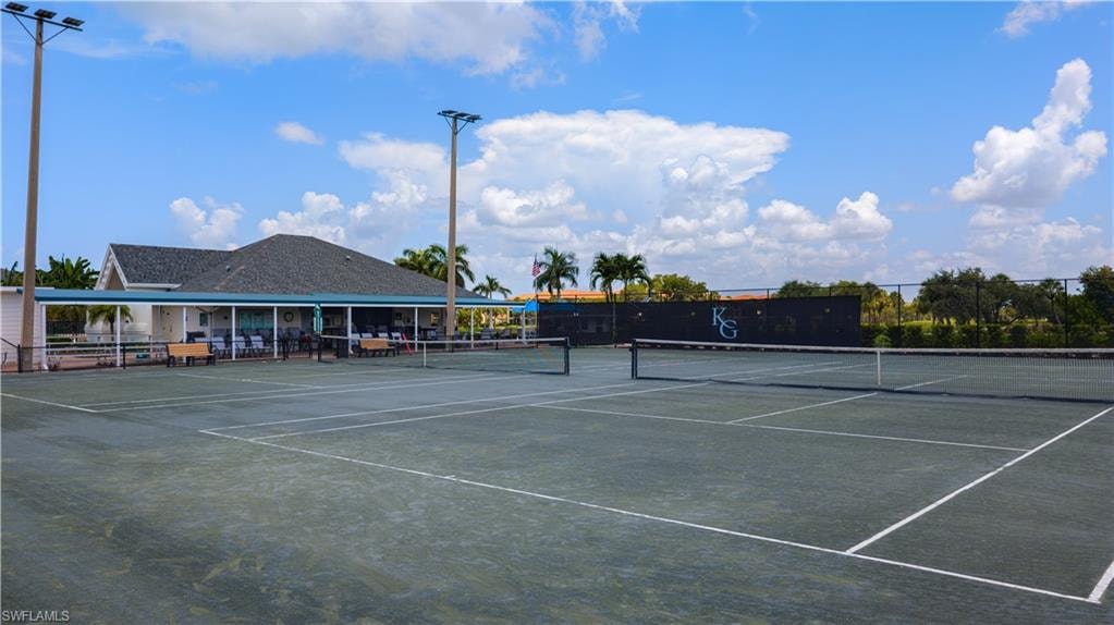Hard surface tennis courts with a net and court lines