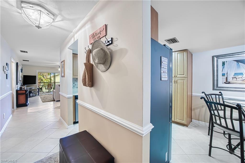 Tiled flooring throughout the hallway