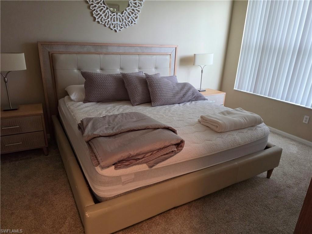 Neutral-toned walls complement plush carpeting