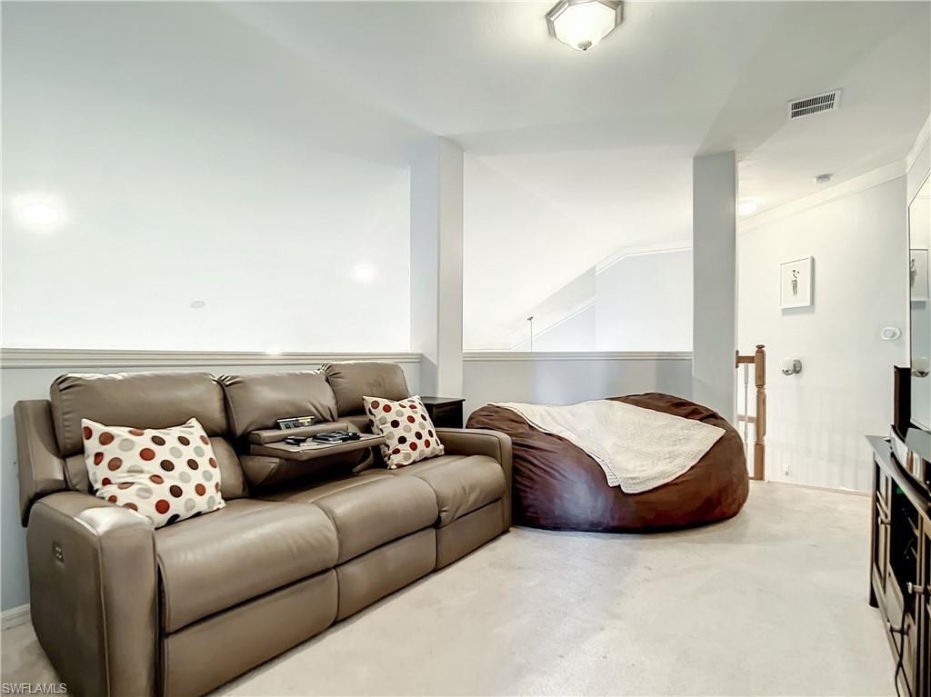 Recessed lighting, wall-mounted light fixture, carpeting, painted walls, and white trim