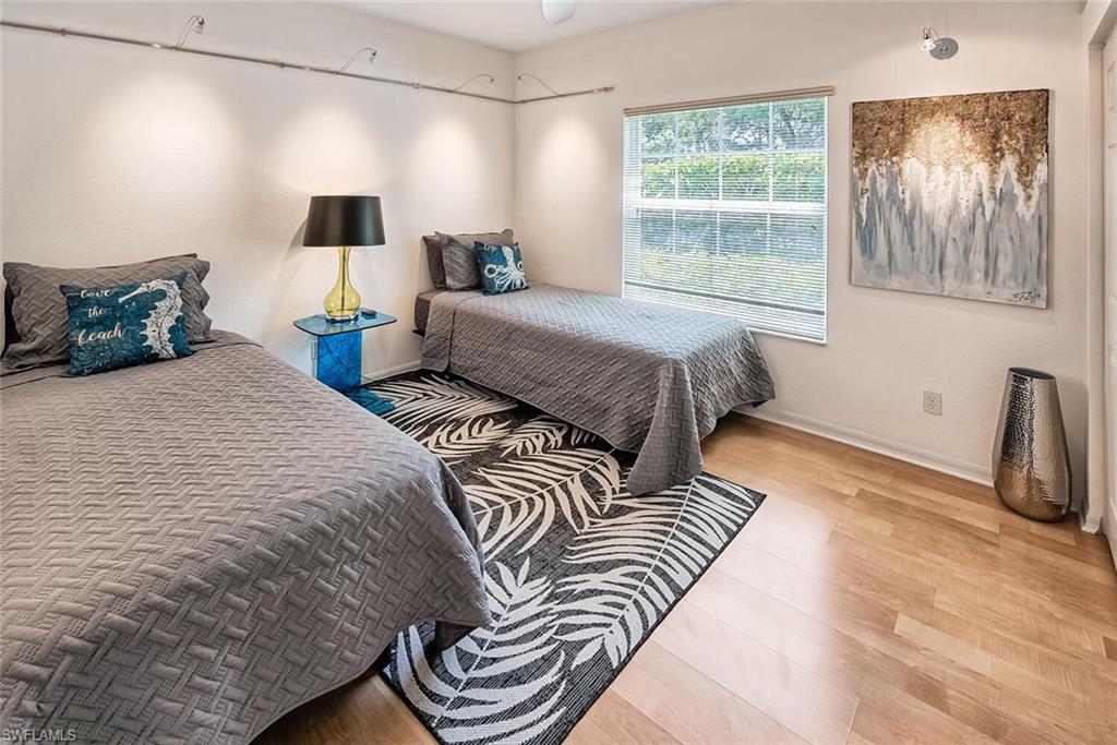 Bedroom with wood-type flooring