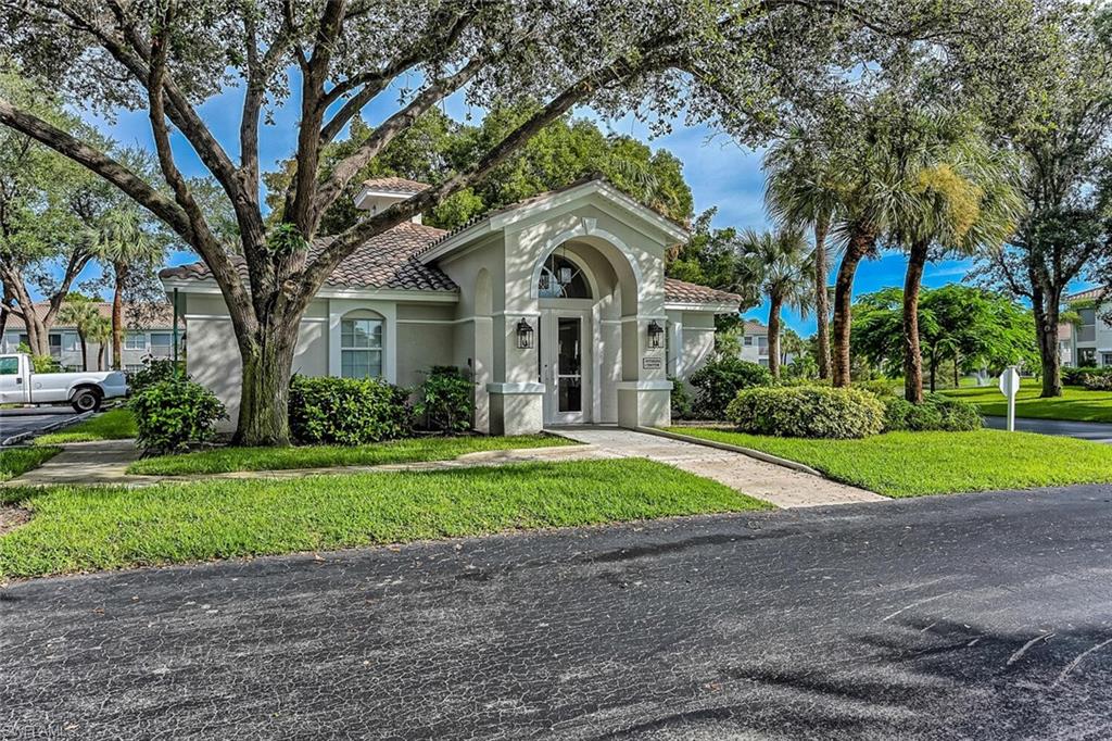 Mediterranean / spanish-style home with a front lawn