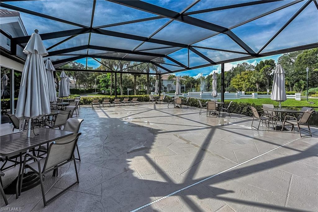 View of patio featuring glass enclosure
