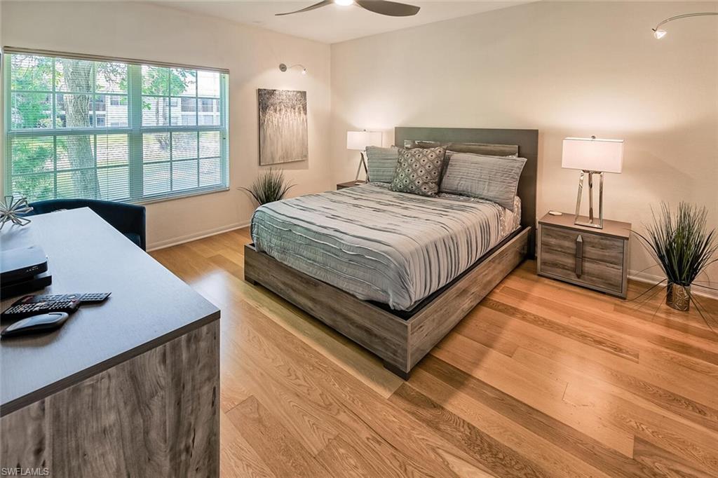 Bedroom featuring light hardwood / wood-style floors and ceiling fan