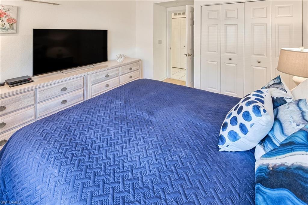 Bedroom with carpet and a closet