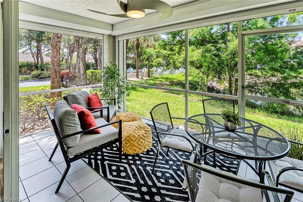 Sunroom / solarium featuring ceiling fan