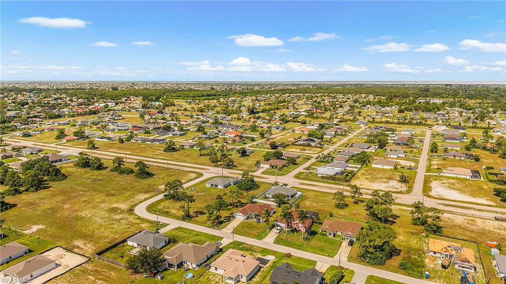 Expansive residential area featuring numerous single-story homes, established street grid, and scattered mature trees
