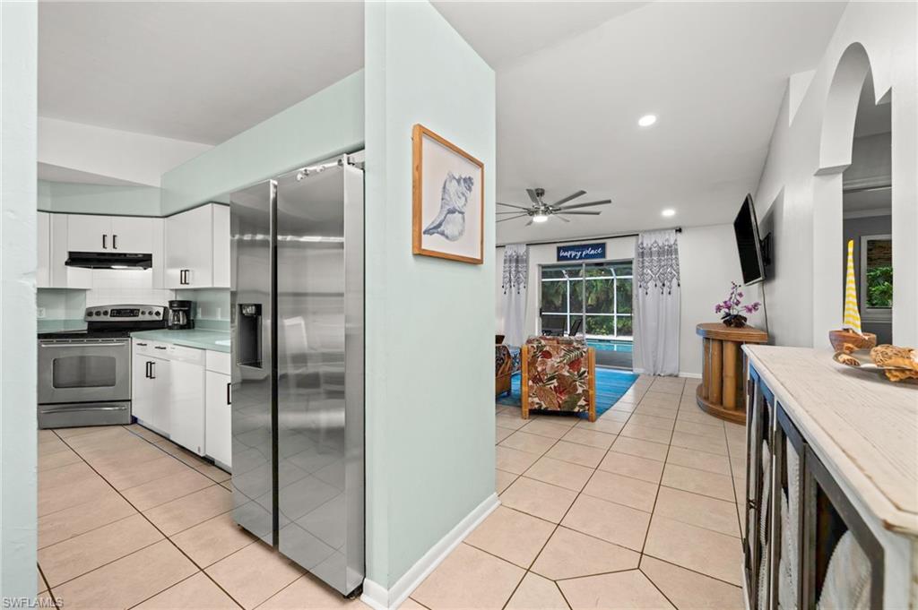 View from the front door to the kitchen and the pool area