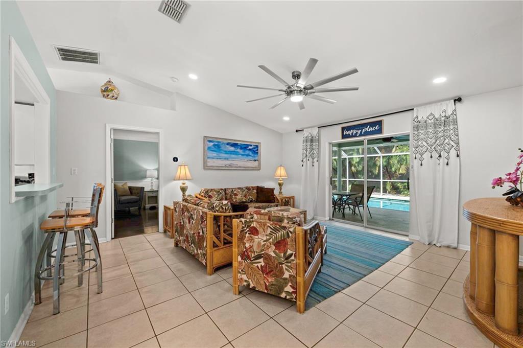 Living room as you enter, looking straight through to the pool