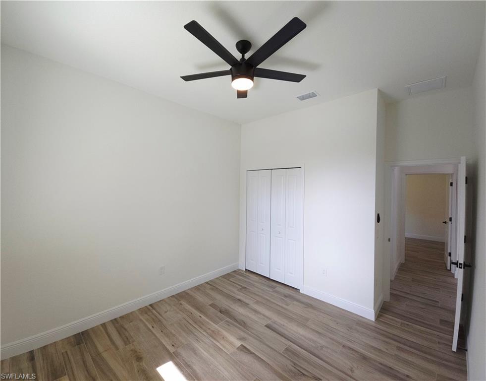 Bedroom 3, Recessed lighting, wood-finish flooring, and a ceiling fan with integrated lighting
