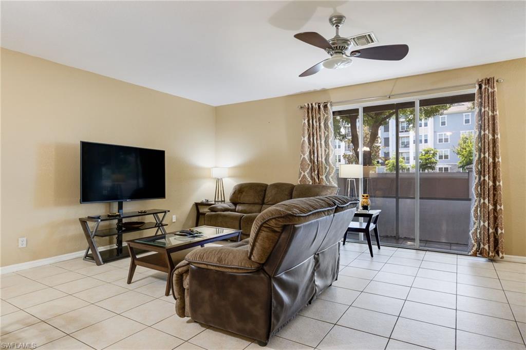 Recessed lighting, ceiling fan, sliding glass doors, ceramic tile flooring, and neutral wall tones