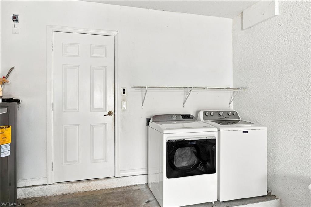 White paneled door, wall-mounted wire shelving, and concrete flooring