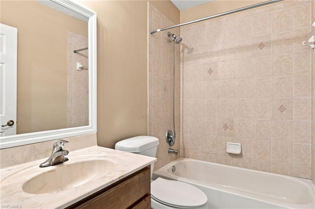 Vanity with integrated sink and stone-look countertop