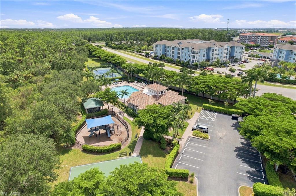 Community amenities featuring a swimming pool, tennis courts, and recreational play area