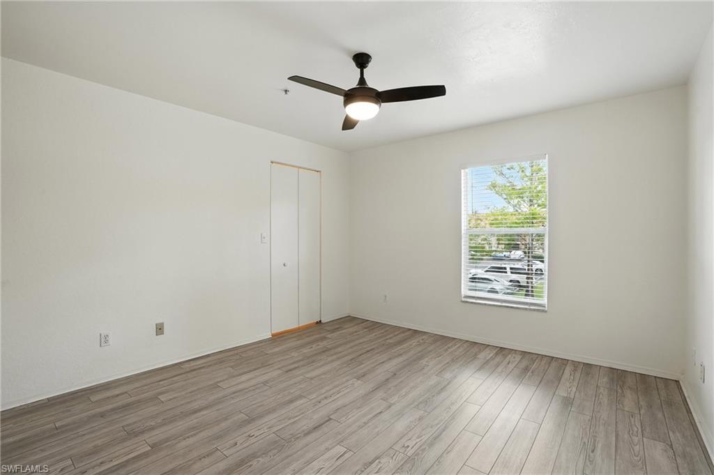 Spare room featuring light wood finished floors and a ceiling fan