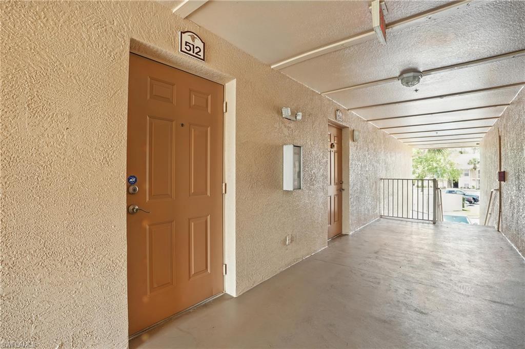Property entrance featuring stucco siding