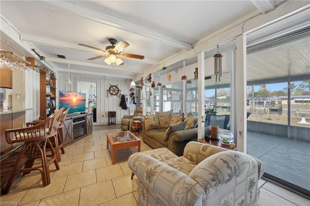 Enclosed Florida Room opens to the kitchen.