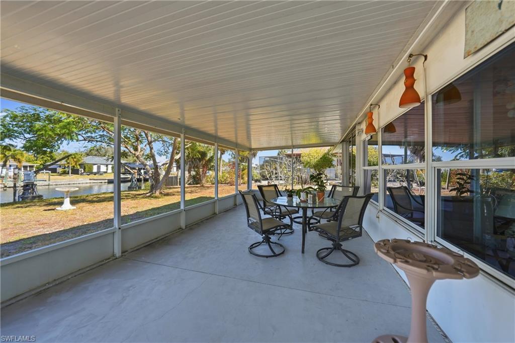 Screened patio with a concrete floor.