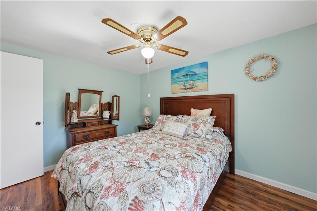 Wood-finish laminate flooring, ceiling fan, and solid interior door
