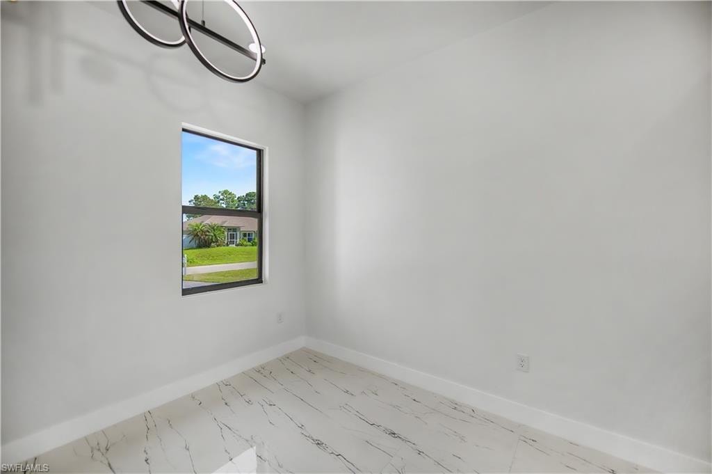 Recessed lighting, contemporary ceiling fixture, single pane window, light-toned walls, and wood-finish flooring