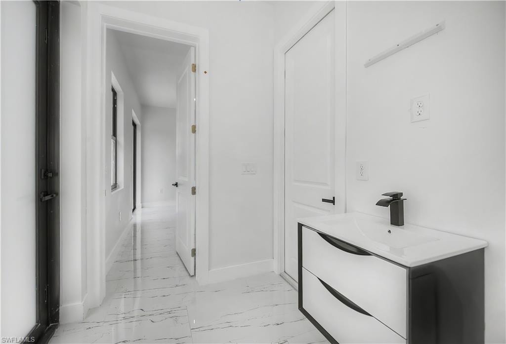 Modern vanity with integrated sink and matte black faucet