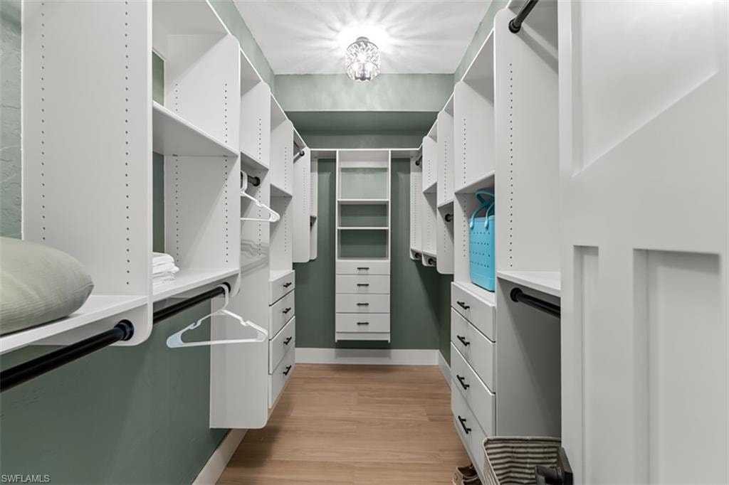 1st. Bedrm light wood-finish flooring, recessed lighting, and a ceiling fan