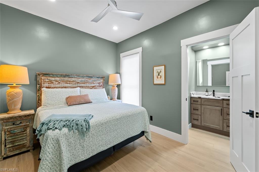 3rd Bedrm Recessed lighting, ceiling fan, wood-finish flooring, white trim, and a glass-paneled door