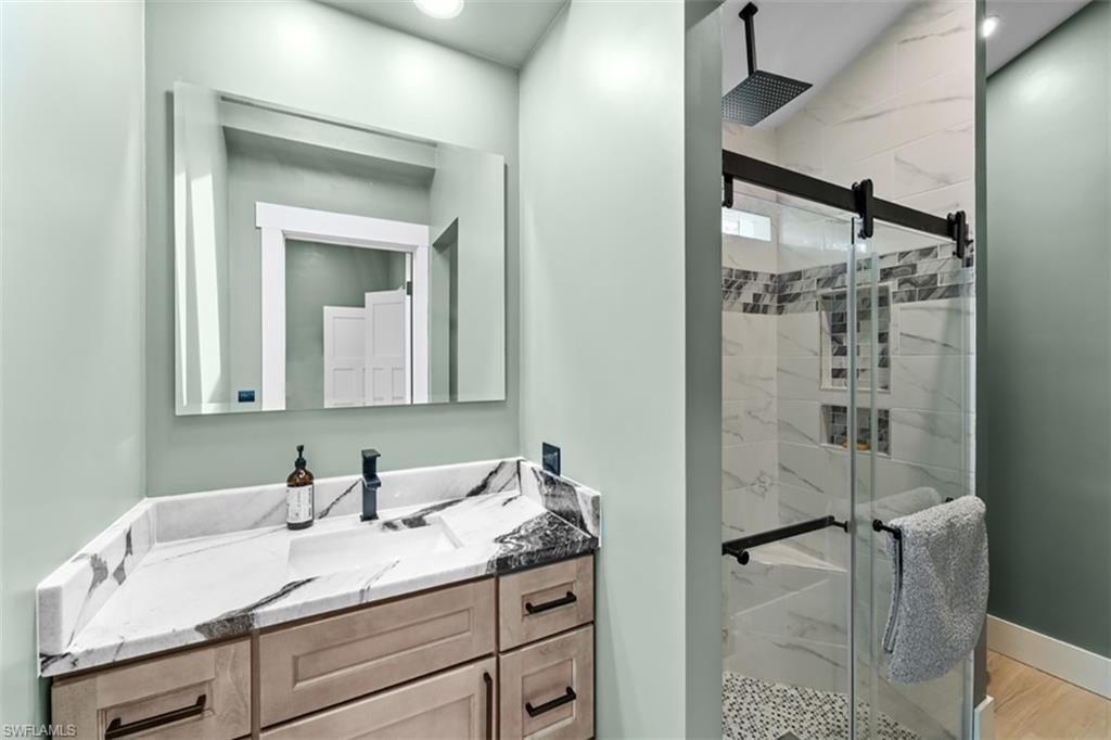4th Bedrm Floor-to-ceiling windows, wood-finish flooring, built-in closet organization, contemporary ceiling fan, and recessed lighting