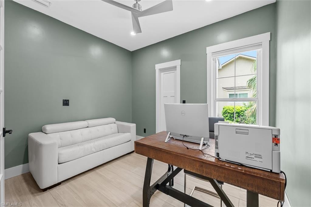Light wood-finish flooring, recessed lighting, and a modern ceiling fan