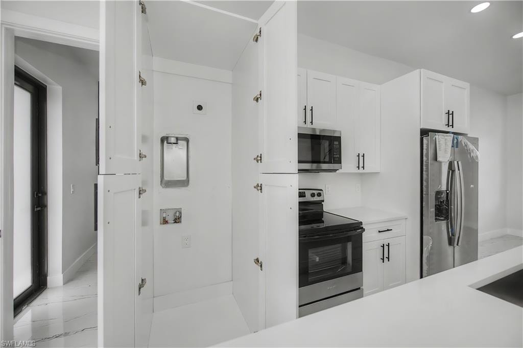 Integrated laundry closet with bi-fold doors