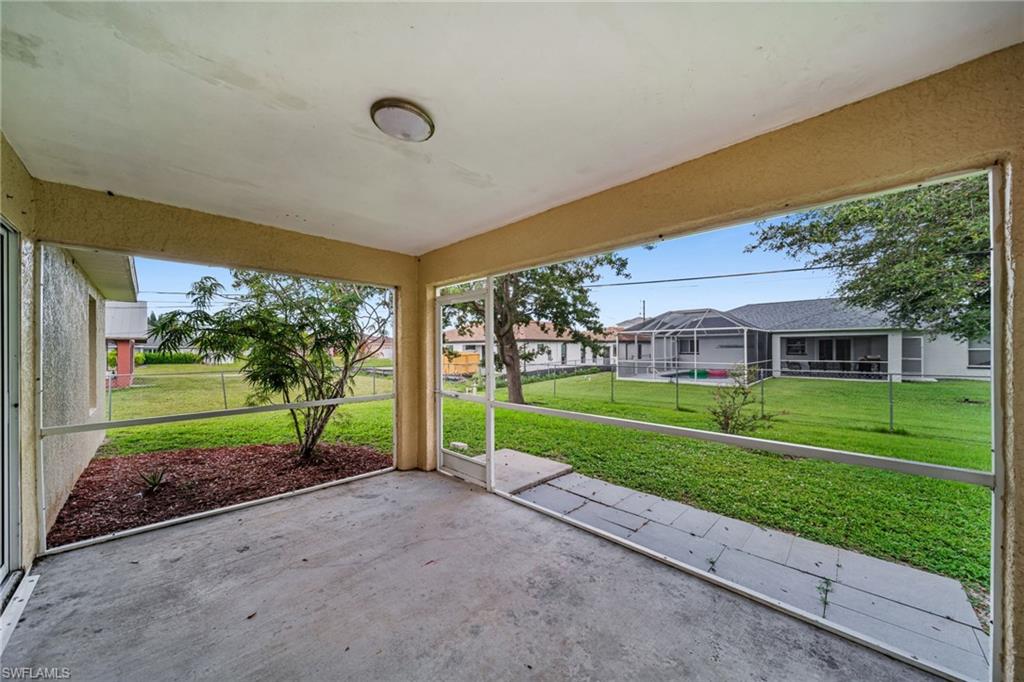 Screened patio with concrete flooring, recessed lighting, and direct access to a grassy yard