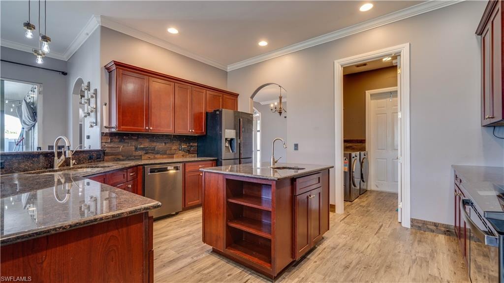 Kitchen - Island with prep sink and storage