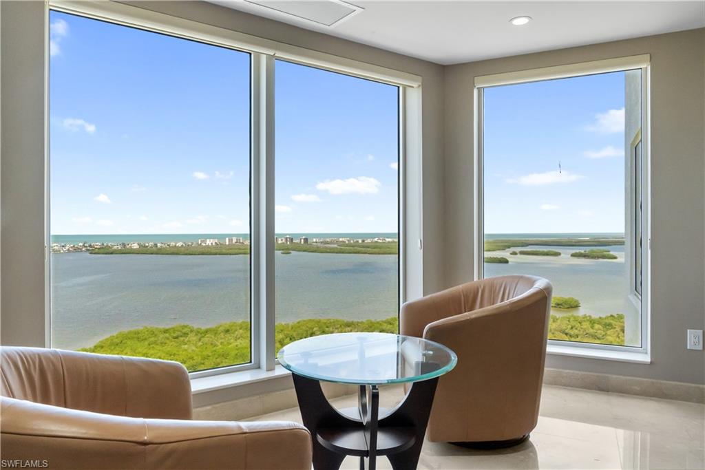 Expansive windows offering water and island scenery