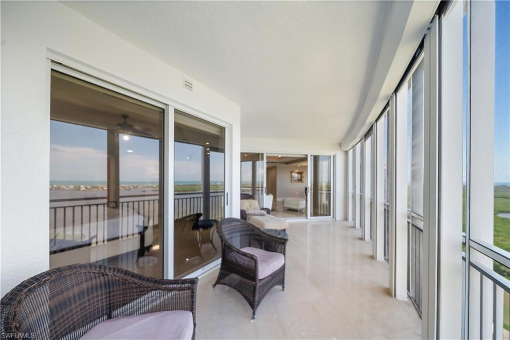 Expansive balcony with light-colored tile flooring