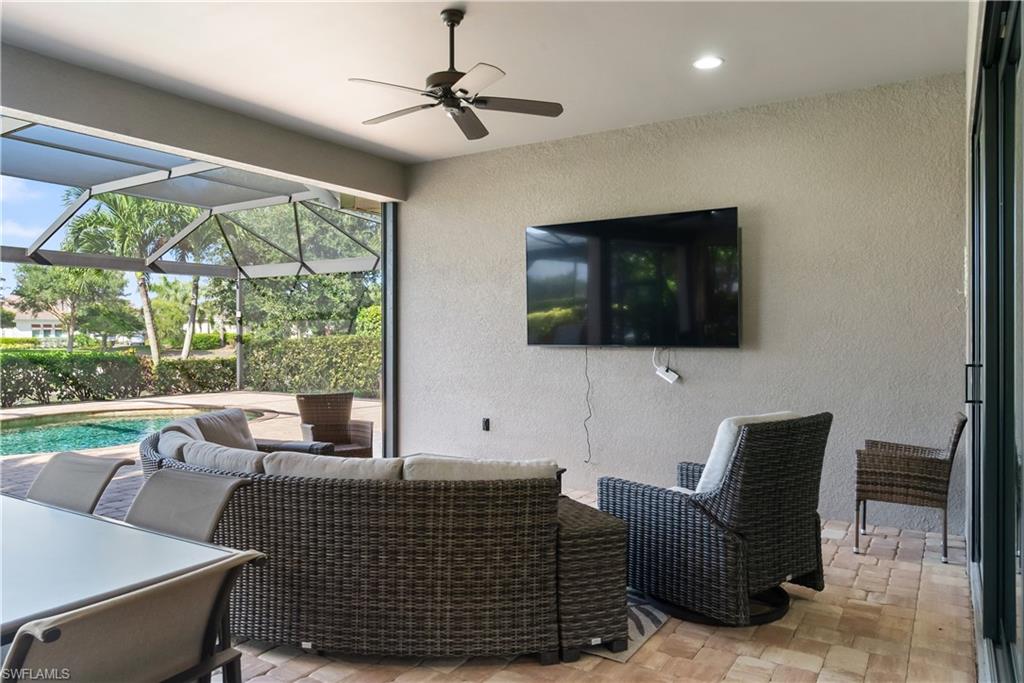 Screened patio featuring a ceiling fan, recessed lighting, and brick paver flooring