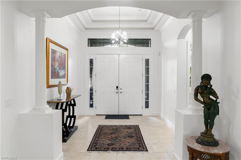 Double entry doors with sidelights and transom window