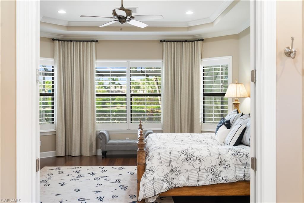Wood-finish flooring, recessed lighting, and a ceiling fan