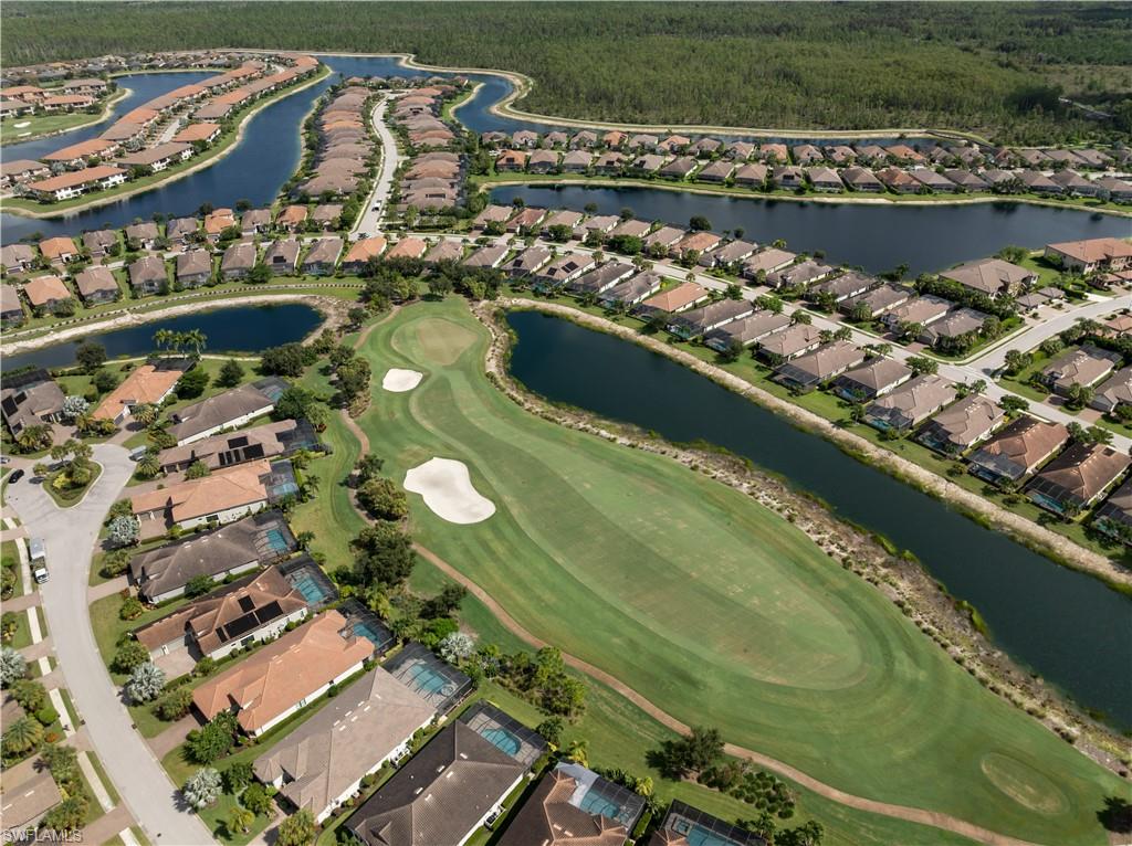 Expansive golf course with sand traps and water features