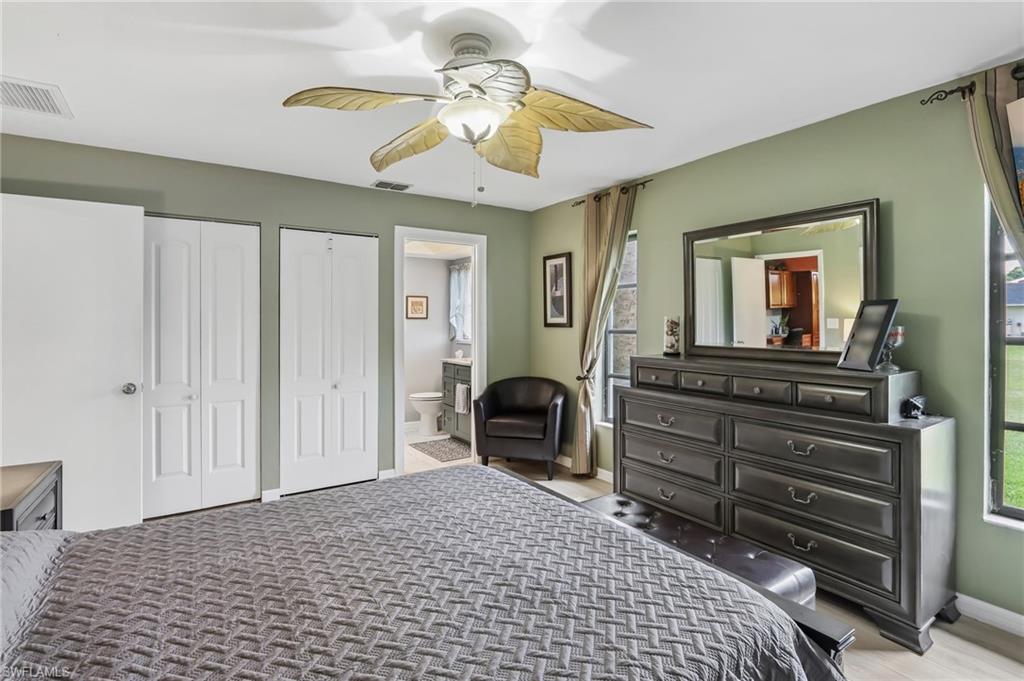 Recessed lighting, ceiling fan, white bi-fold closet doors, and light wall paint