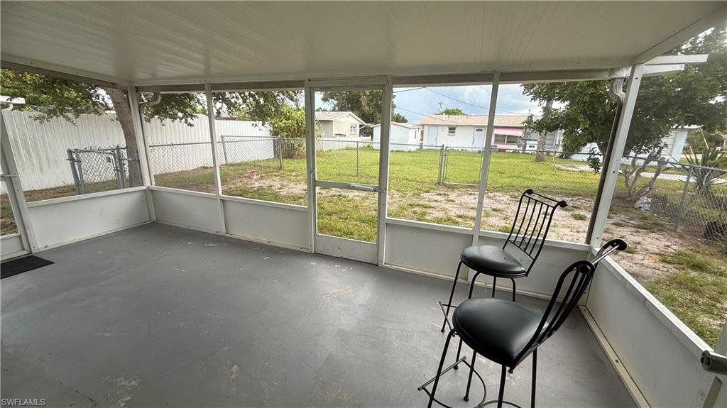 Unfurnished sunroom featuring plenty of natural light