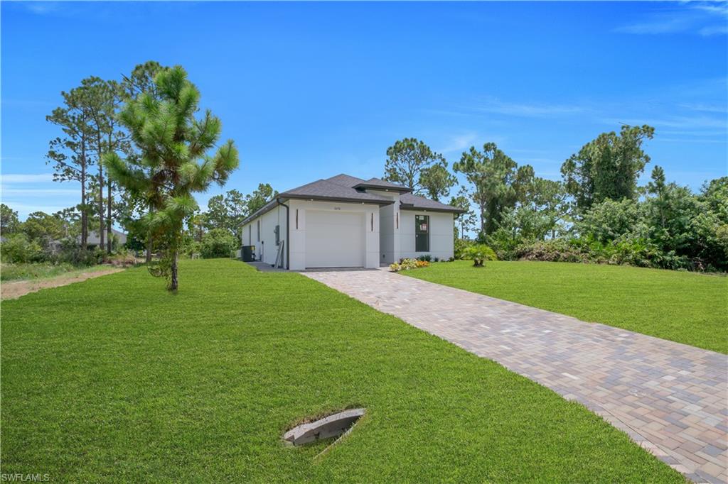 Modern exterior with white siding and dark trim accents