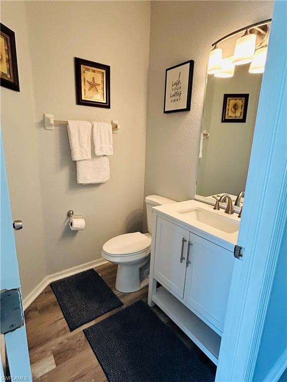 Updated vanity with white cabinetry, integrated sink, and brushed nickel fixtures