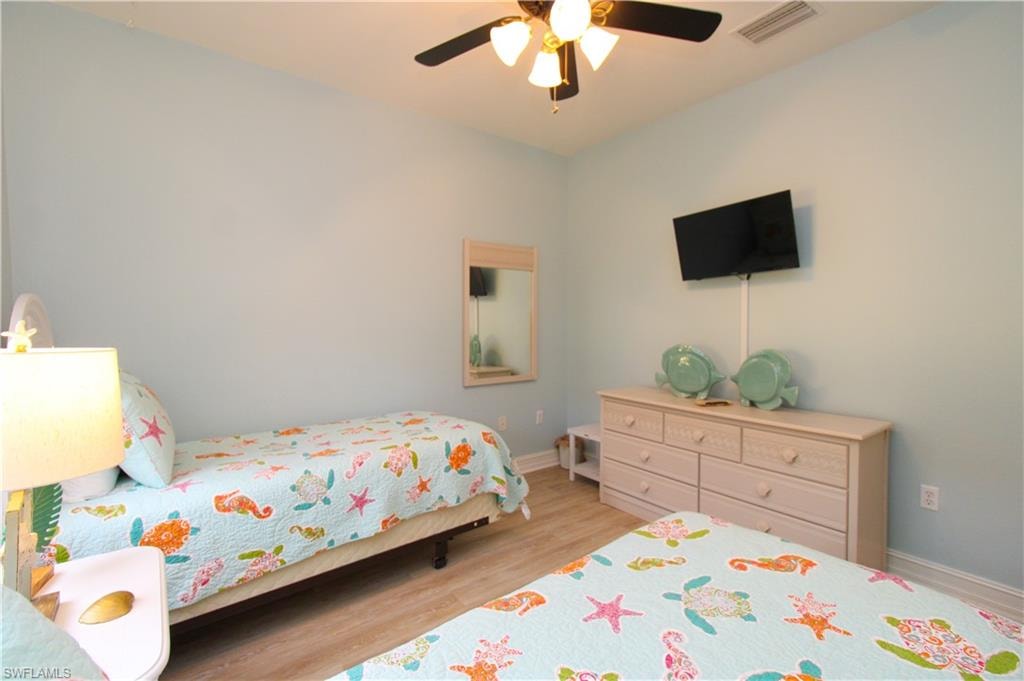 Bedroom featuring light hardwood / wood-style flooring and ceiling fan