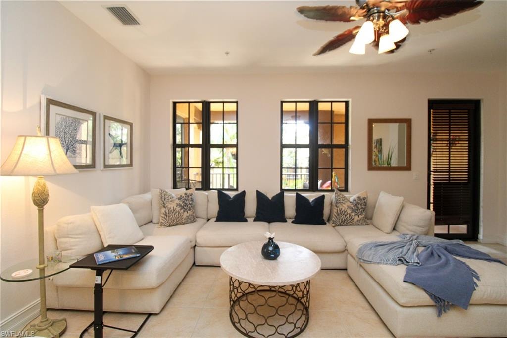 Tiled living room with ceiling fan
