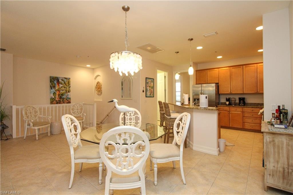 Dining space featuring a chandelier and light tile patterned floors
